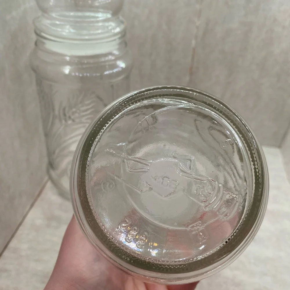 4 VINTAGE PLANTERS MR PEANUT GLASS JARS WITH LIDS (2) 1982, 1983, 1984